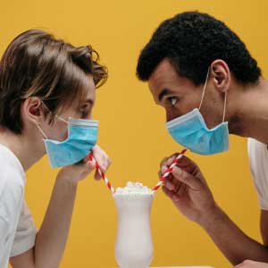 Man & Woman drinking milkshake
