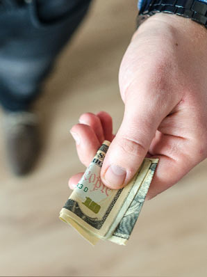 Hand holding paper money